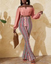 Load image into Gallery viewer, Woman wearing pink off-shoulder top and multicolor pants
