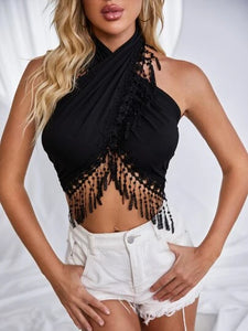 Woman wearing black fringe halter top
