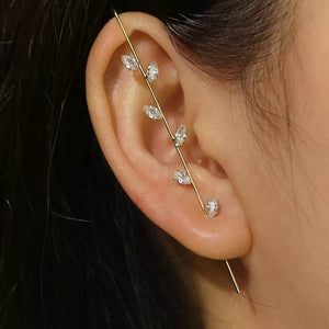 Woman wearing wrap hook earring with rhinestones