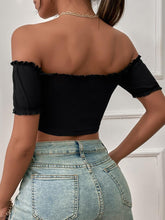 Load image into Gallery viewer, Woman wearing black off-shoulder crop top