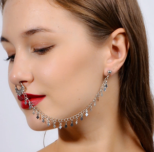 Woman wearing nose to ear tassel chain