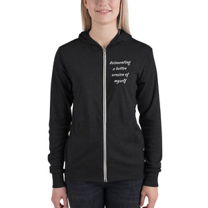 Woman wearing charcoal color hoodie that says "Reinventing a better version of myself" on front