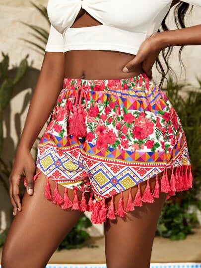 Black woman wearing multicolor shorts with tassels