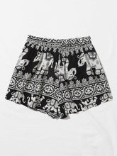 Load image into Gallery viewer, Black and white shorts with elephants print
