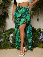 Load image into Gallery viewer, Woman wearing long green floral skirt with split on the side