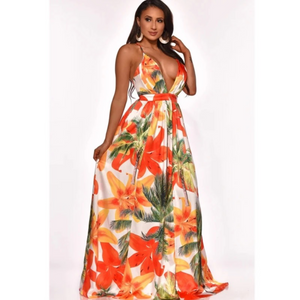 Woman wearing long floral maxi dress with spaghetti straps