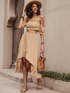 Woman wearing khaki color off shoulder top and long skirt