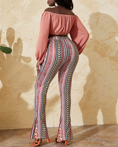 Woman wearing pink off-shoulder top and multicolor pants  Edit alt text