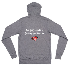 Gray color zip hoodie that says Your First Mistake Is Thinking You Know Me with a picture of a tongue sticking out