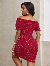 Load image into Gallery viewer, Woman wearing off-shoulder red dress with white polka dots 