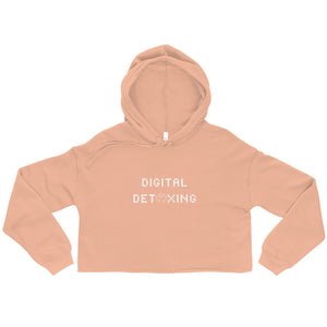 Peach color crop hoodie that says Digital Detoxing in white