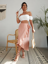Load image into Gallery viewer, Woman wearing white off-shoulder top and pink long skirt