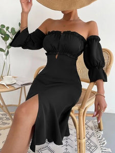 Woman wearing off-shoulder black mid length dress