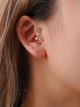 Load image into Gallery viewer, Woman wearing gold spiral ear cuff