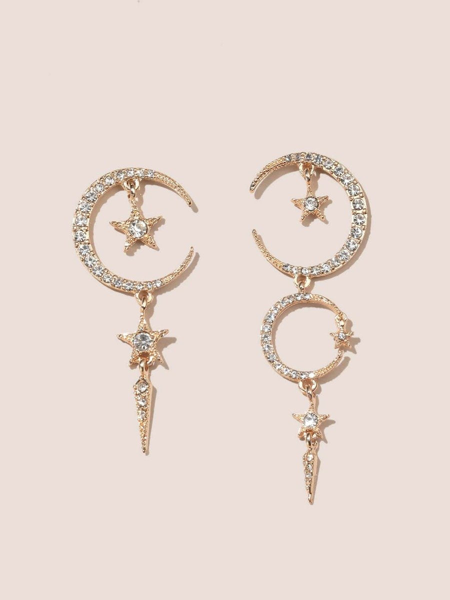 Gold and rhinestone earrings shaped like the moon and stars