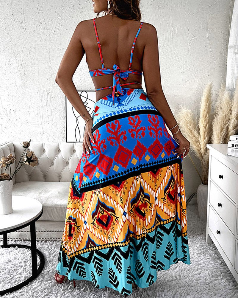 Woman wearing multicolor tribal print crop top and long flowy skirt