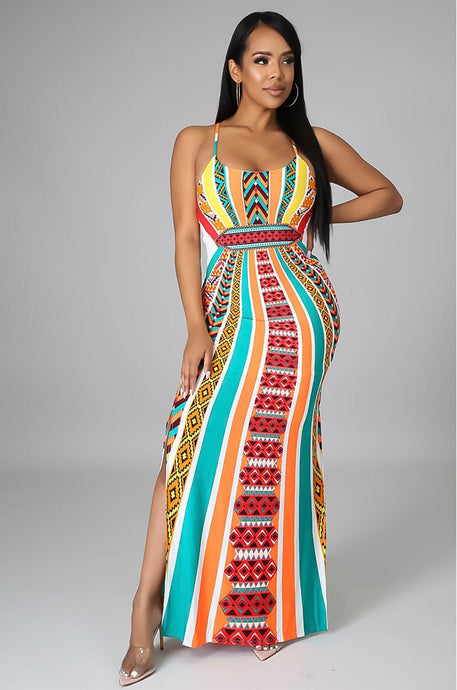 Woman wearing spaghetti strap long multicolor dress