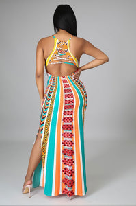 Woman wearing spaghetti strap long multicolor dress